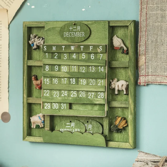 Calendrier perpétuel vintage en bois vert